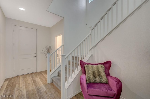 5244 Fiery Sky Ridge St, Las Vegas, NV 89148 - entrance foyer with wood finished floors, stairs, baseboards, and recessed lighting