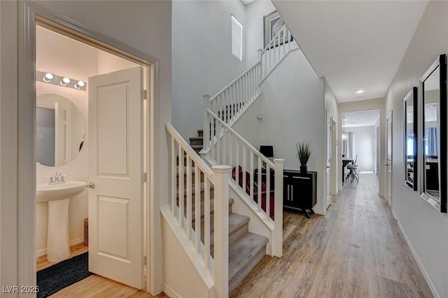 5244 Fiery Sky Ridge St, Las Vegas, NV 89148 - stairs featuring wood finished floors and baseboards