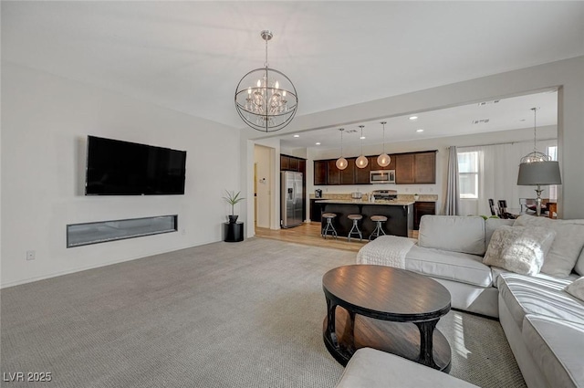 5244 Fiery Sky Ridge St, Las Vegas, NV 89148 - living room with a chandelier, light carpet, and recessed lighting