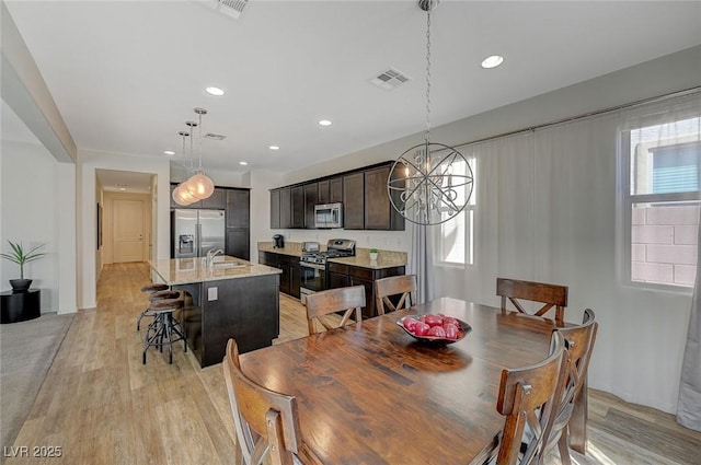 5244 Fiery Sky Ridge St, Las Vegas, NV 89148 - dining space featuring light wood-style flooring, a chandelier, and recessed lighting