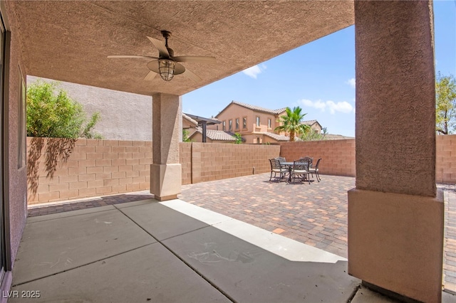11274 Civita St, Las Vegas, NV 89141 - fenced backyard featuring outdoor dining area, a patio, and a ceiling fan