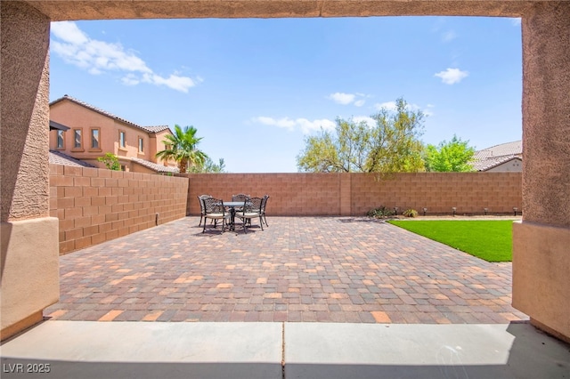 11274 Civita St, Las Vegas, NV 89141 - fenced backyard with outdoor dining space and a patio