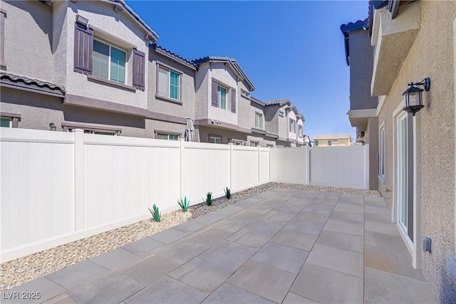 7350 N Decatur Blvd Unit 5, Las Vegas, NV 89131 - fenced backyard with a residential view and a patio area