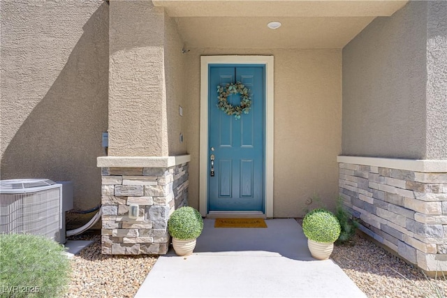7350 N Decatur Blvd Unit 5, Las Vegas, NV 89131 - entrance to property featuring stucco siding, central air condition unit, and stone siding