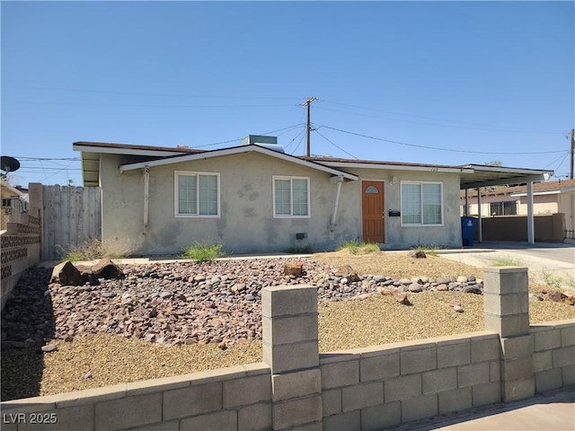 129 Maple St, Henderson, NV 89015 - ranch-style home with stucco siding and a carport