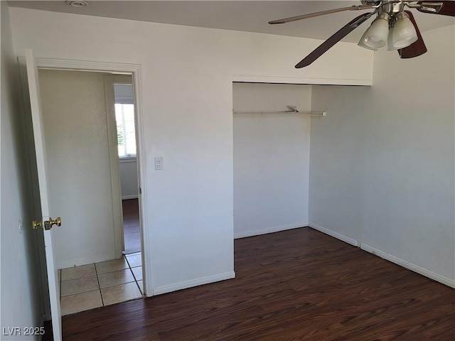 129 Maple St, Henderson, NV 89015 - unfurnished bedroom featuring wood finished floors, baseboards, and a closet