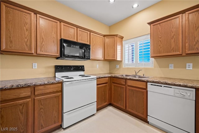 728 Hardy Way Unit E, Mesquite, NV 89027 - kitchen featuring white appliances, a sink, recessed lighting, and brown cabinetry
