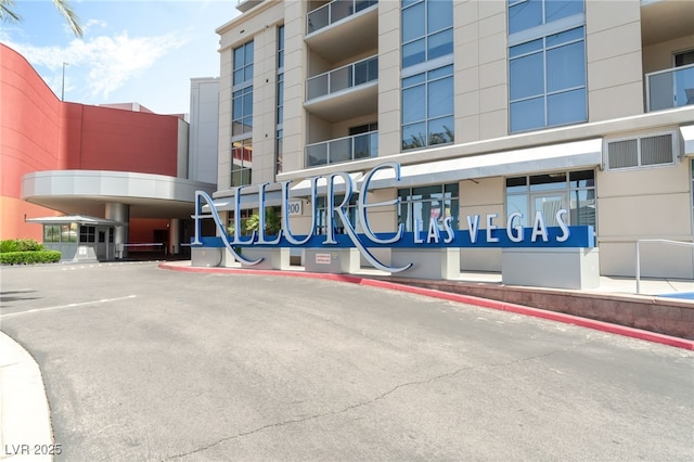 200 W Sahara Ave Unit 3303, Las Vegas, NV 89102 - view of apartment building / complex featuring uncovered parking