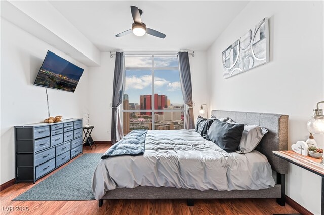 200 W Sahara Ave Unit 3303, Las Vegas, NV 89102 - bedroom with wood finished floors, baseboards, and ceiling fan