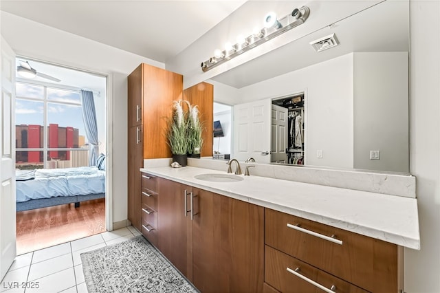 200 W Sahara Ave Unit 3303, Las Vegas, NV 89102 - ensuite bathroom with vanity and tile patterned flooring