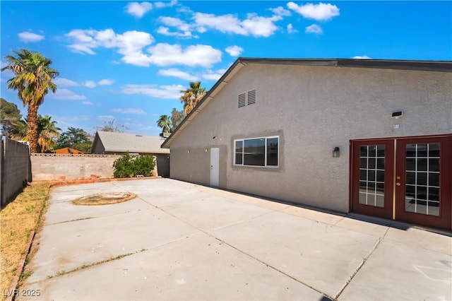 5336 Regal Ave, Las Vegas, NV 89146 - back of property with stucco siding and a patio