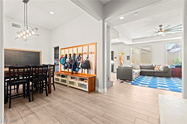 245 Hull St, Henderson, NV 89015 - dining area featuring wood finished floors, a ceiling fan, a chandelier, and baseboards