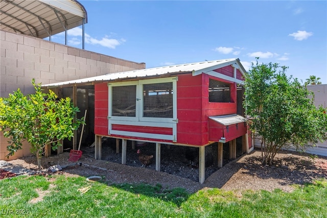 245 Hull St, Henderson, NV 89015 - view of property exterior featuring exterior structure, an outbuilding, and metal roof