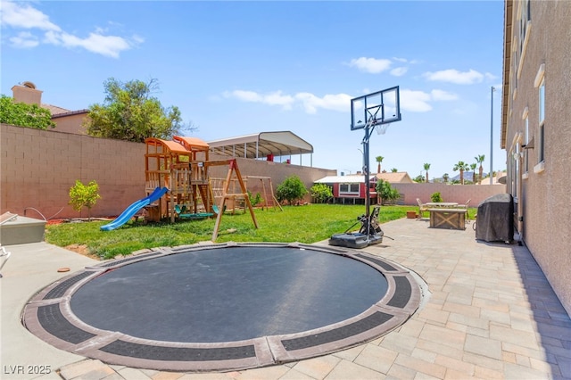 245 Hull St, Henderson, NV 89015 - view of patio / terrace featuring a trampoline and a playground