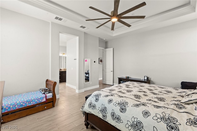 245 Hull St, Henderson, NV 89015 - bedroom featuring a tray ceiling, light wood finished floors, crown molding, baseboards, and a ceiling fan