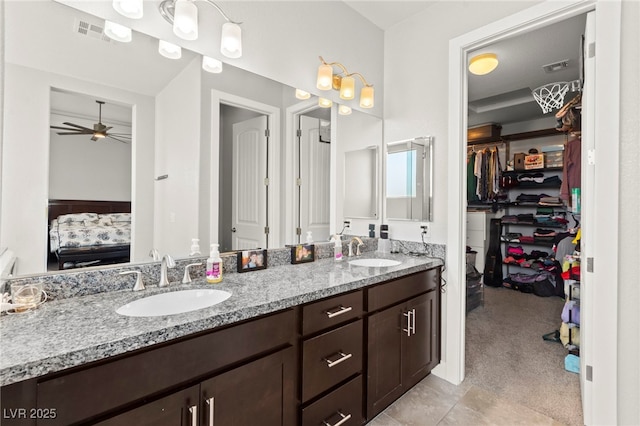 245 Hull St, Henderson, NV 89015 - full bathroom featuring ensuite bath, double vanity, ceiling fan, and a spacious closet