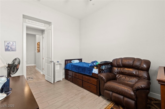 245 Hull St, Henderson, NV 89015 - bedroom with light wood-type flooring and baseboards