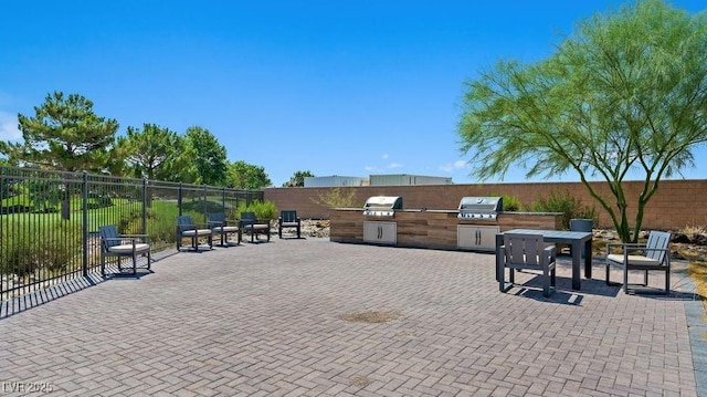 4450 E Brusca Ct, Pahrump, NV 89061 - surrounding community featuring exterior kitchen and a patio