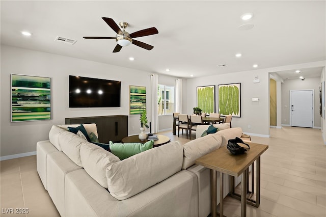 4450 E Brusca Ct, Pahrump, NV 89061 - living area with ceiling fan, baseboards, recessed lighting, and light tile patterned flooring