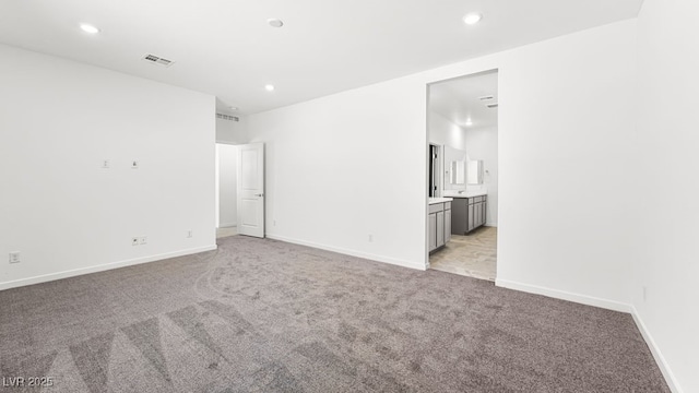 4450 E Brusca Ct, Pahrump, NV 89061 - unfurnished room featuring light carpet and recessed lighting