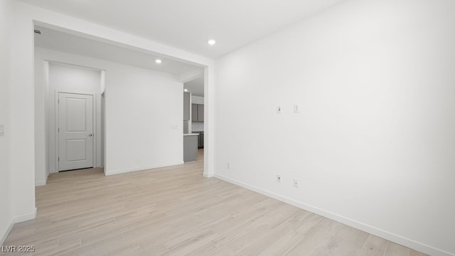 4450 E Brusca Ct, Pahrump, NV 89061 - empty room with light wood-style flooring and recessed lighting