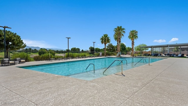 4450 E Brusca Ct, Pahrump, NV 89061 - community pool featuring a patio area and a mountain view