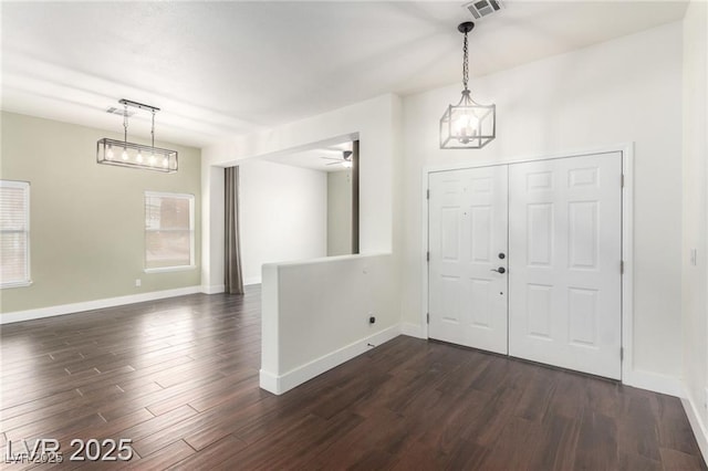 10058 Saint Augustine St, Las Vegas, NV 89183 - entrance foyer with dark wood finished floors, baseboards, a ceiling fan, and plenty of natural light