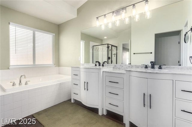 10058 Saint Augustine St, Las Vegas, NV 89183 - bathroom featuring double vanity, a shower stall, and a bath