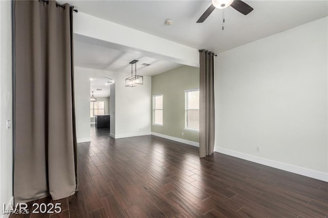10058 Saint Augustine St, Las Vegas, NV 89183 - empty room featuring plenty of natural light, dark wood-style flooring, baseboards, and a ceiling fan