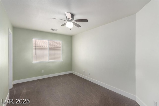 10058 Saint Augustine St, Las Vegas, NV 89183 - unfurnished room with dark colored carpet, a ceiling fan, and baseboards