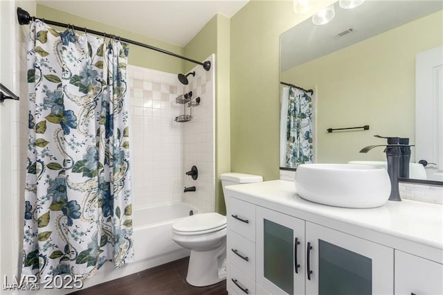 10058 Saint Augustine St, Las Vegas, NV 89183 - bathroom featuring vanity, toilet, shower / tub combo, and wood finished floors