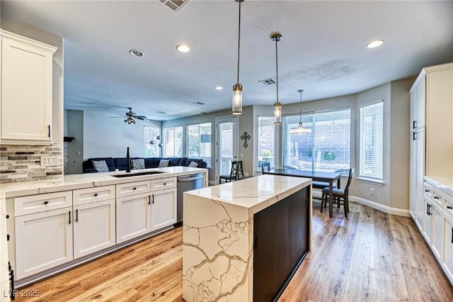 2285 Moresca Ave, Henderson, NV 89052 - kitchen featuring a sink, recessed lighting, light wood-style floors, dishwasher, and open floor plan
