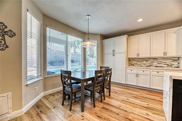2285 Moresca Ave, Henderson, NV 89052 - dining area featuring healthy amount of natural light, light wood-style flooring, baseboards, and recessed lighting