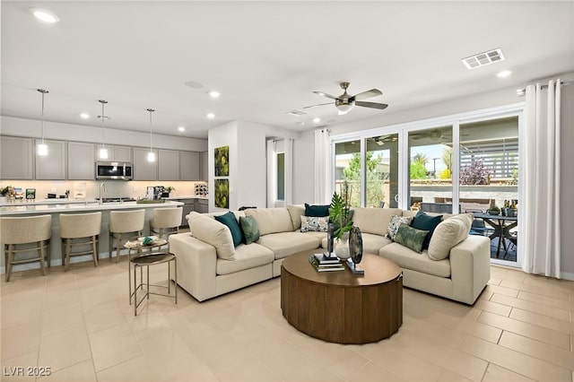 4365 E Brusca Way, Pahrump, NV 89061 - living area with recessed lighting, light tile patterned floors, and a ceiling fan