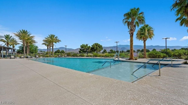 4365 E Brusca Way, Pahrump, NV 89061 - community pool with a mountain view and a patio