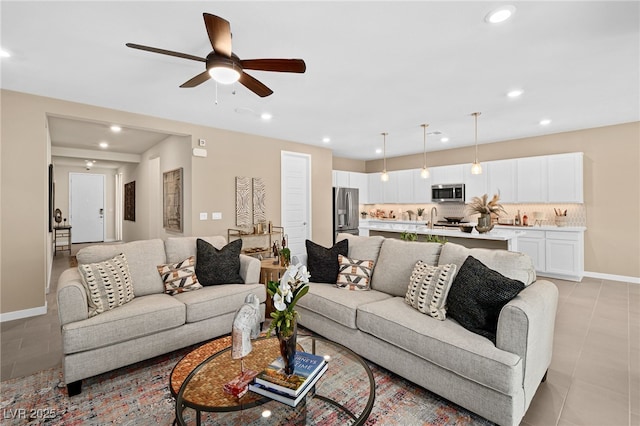 4365 E Murlo Rd, Pahrump, NV 89061 - living area featuring light tile patterned flooring, recessed lighting, a ceiling fan, and baseboards