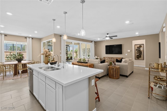4365 E Murlo Rd, Pahrump, NV 89061 - kitchen with a sink, a kitchen island with sink, ceiling fan, light countertops, and recessed lighting