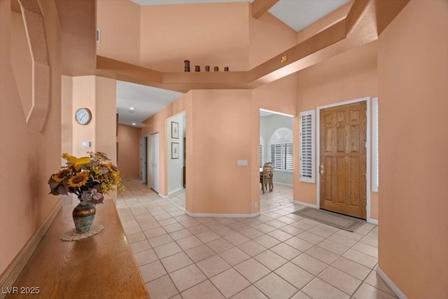 1105 Malachite Ct, Henderson, NV 89011 - foyer featuring light tile patterned flooring, baseboards, and a towering ceiling