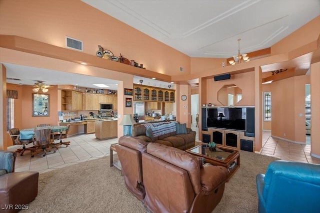 1105 Malachite Ct, Henderson, NV 89011 - living room with light tile patterned floors, light colored carpet, and a chandelier