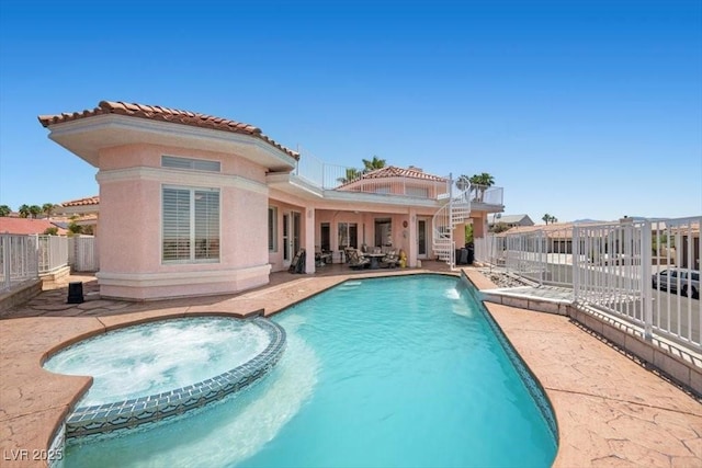 1105 Malachite Ct, Henderson, NV 89011 - view of swimming pool featuring a fenced backyard, a patio, and a pool with connected hot tub
