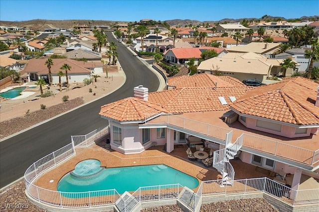 1105 Malachite Ct, Henderson, NV 89011 - aerial perspective of suburban area with a pool and mountains