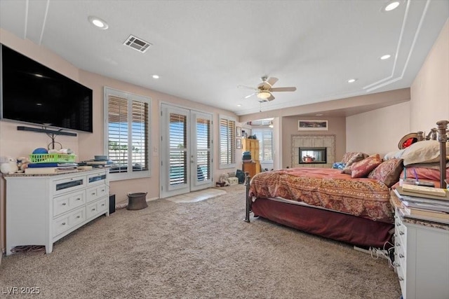 1105 Malachite Ct, Henderson, NV 89011 - bedroom with access to outside, light carpet, recessed lighting, french doors, and a fireplace