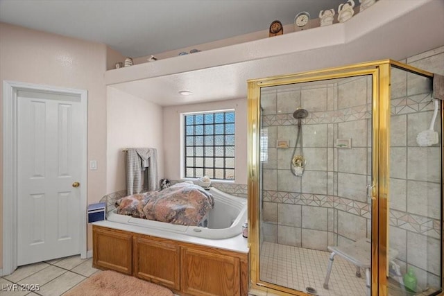 1105 Malachite Ct, Henderson, NV 89011 - bathroom with tile patterned floors, a stall shower, and a garden tub