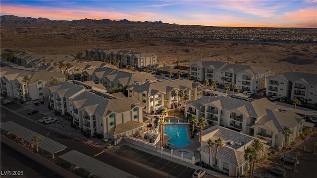 3550 Bay Sands Dr Unit 1003, Laughlin, NV 89029 - aerial view at dusk of view of pool, a mountain view, and a residential view