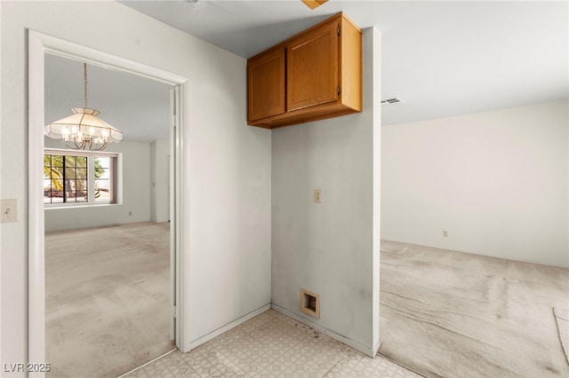 433 Old Palms Dr, Las Vegas, NV 89123 - laundry area featuring a chandelier, cabinet space, light carpet, and light flooring