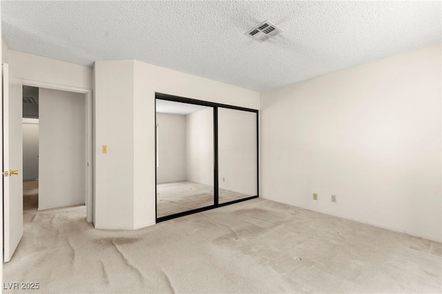 433 Old Palms Dr, Las Vegas, NV 89123 - unfurnished bedroom featuring carpet flooring, a textured ceiling, and a closet