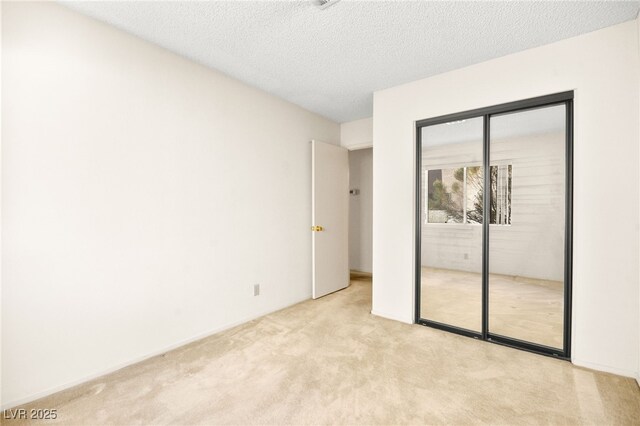 433 Old Palms Dr, Las Vegas, NV 89123 - unfurnished bedroom featuring carpet flooring, a closet, and a textured ceiling