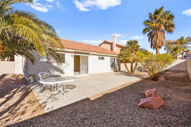 433 Old Palms Dr, Las Vegas, NV 89123 - back of house with a tiled roof, a fenced backyard, a patio, and stucco siding