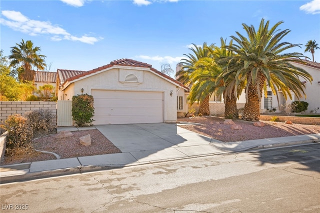 433 Old Palms Dr, Las Vegas, NV 89123 - view of front of house with a tile roof, an attached garage, stucco siding, and concrete driveway