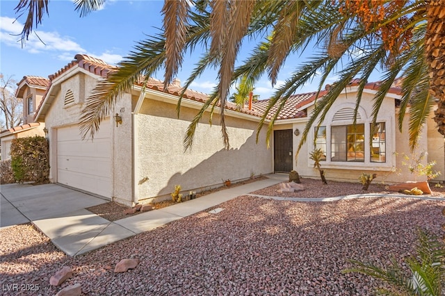 433 Old Palms Dr, Las Vegas, NV 89123 - mediterranean / spanish-style house featuring an attached garage, stucco siding, concrete driveway, and a tiled roof